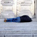 A Man Sleeping on a Stone Stairwell, North Philadelphia, PA